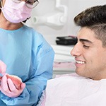 A dentist and patient during a dental appointment