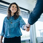 A person smiling during a job interview