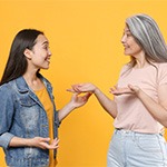 Two people with dentures having a conversation