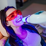 Woman getting professional teeth whitening