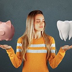 Tooth being balanced against a coin